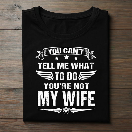 Black t-shirt with white text on a wooden surface