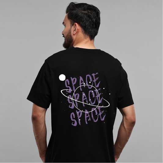 Person wearing a black t-shirt with 'SPACE' text and graphic on the back against a gray background