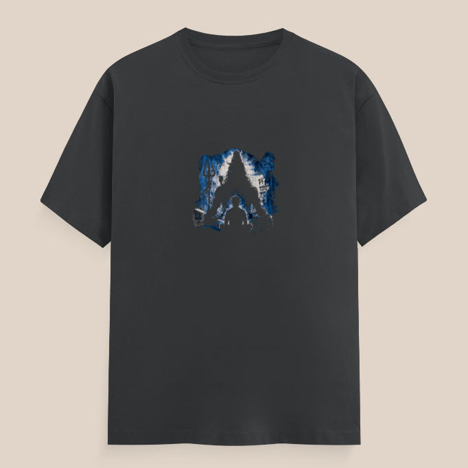 Black t-shirt with a blue mahadev silhouette graphic design and a trident on a white and blue background and a man sitting in front of him