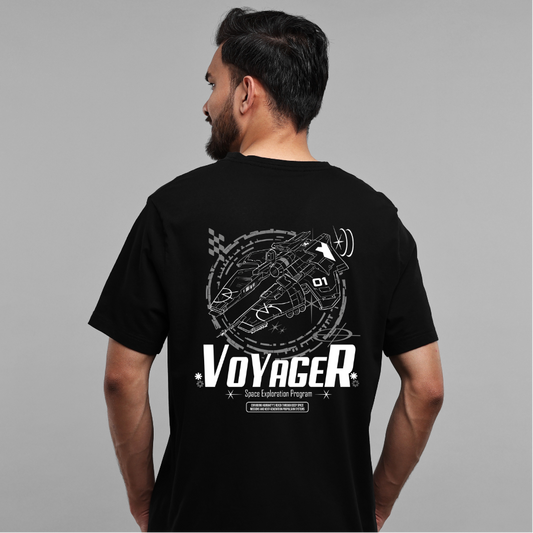 Man wearing a black t-shirt with 'Voyager' design on the back against a gray background