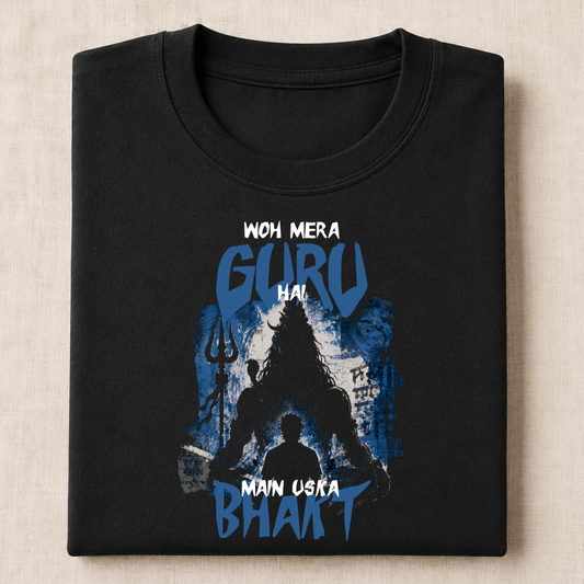 Black t-shirt with blue mahadev silhouette graphic design and text on a beige background with a man sitting in front of him