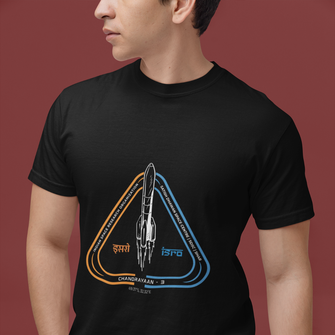 Person wearing a black t-shirt with a rocket design on a red background