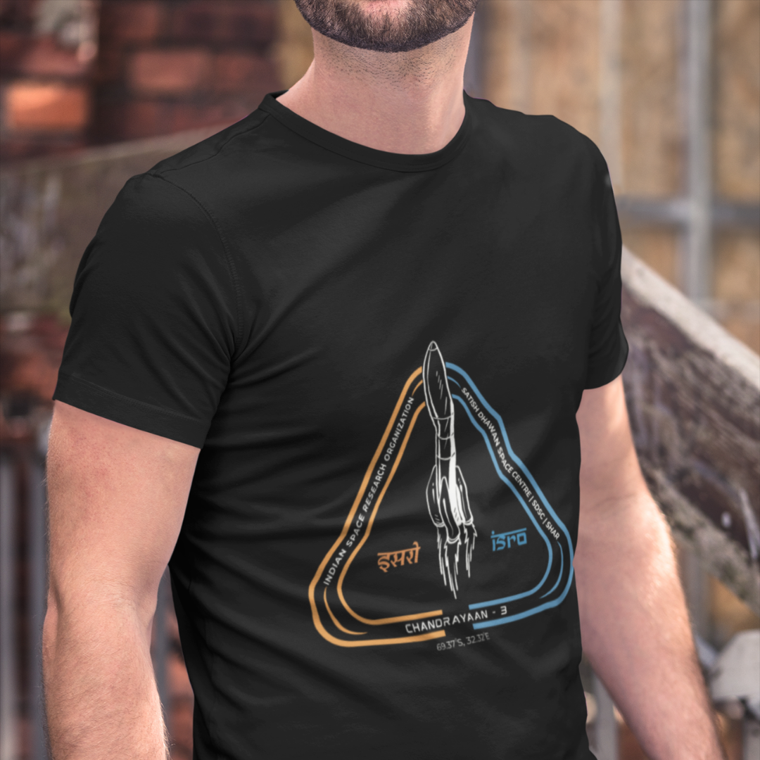 Person wearing a black t-shirt with a rocket design on it.