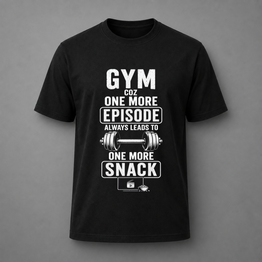 A black short-sleeve crewneck t-shirt with a white graphic print on the front. The graphic features the text 'GYM COZ ONE MORE EPISODE ALWAYS LEADS TO ONE MORE SNACK' surrounding an illustration of a barbell and a snack bag.