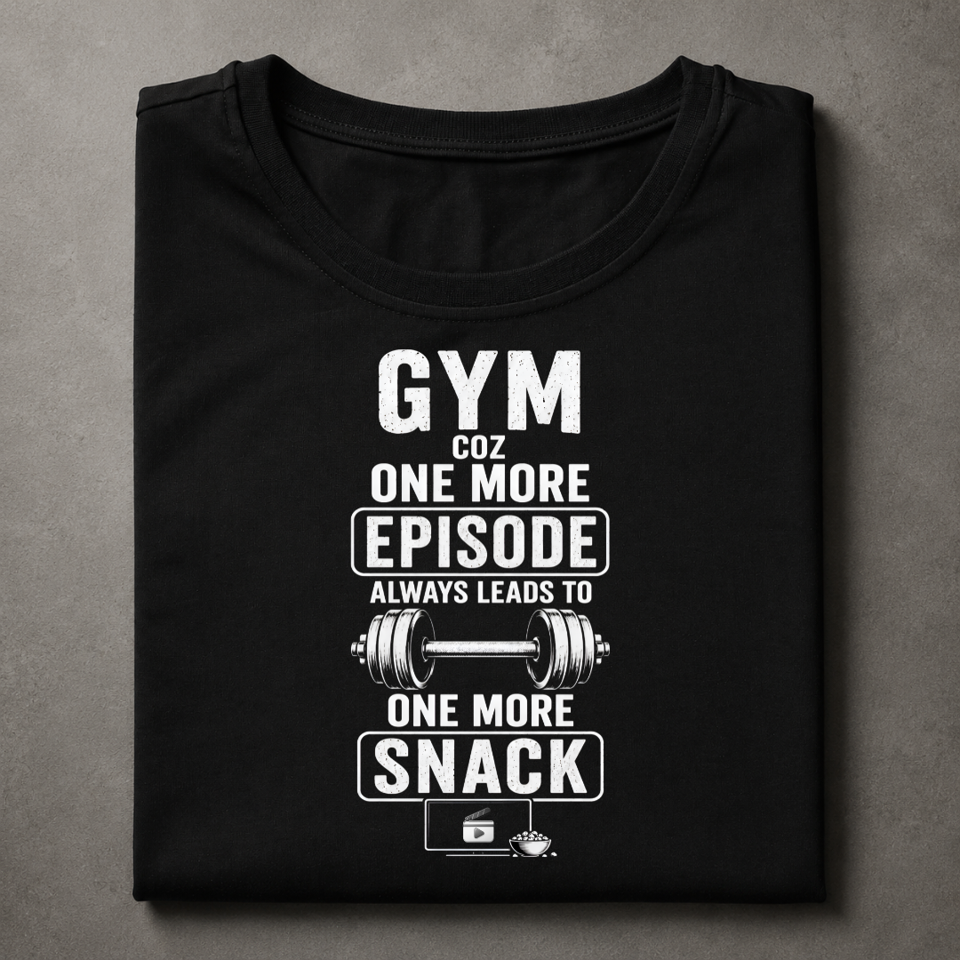 A black crewneck t-shirt with a white graphic print that reads 'GYM COZ ONE MORE EPISODE ALWAYS LEADS TO ONE MORE SNACK' accompanied by a barbell illustration, displayed flat on a textured gray background.