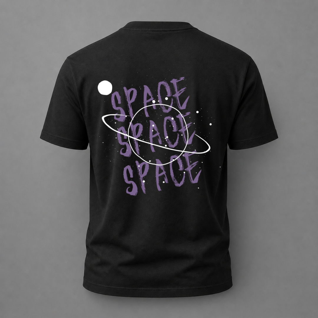 A black short-sleeve t-shirt shown from the back, featuring a purple and white graphic design with the word 'SPACE' repeated in a stylized font, a white ring, and a white planet against a gray background.