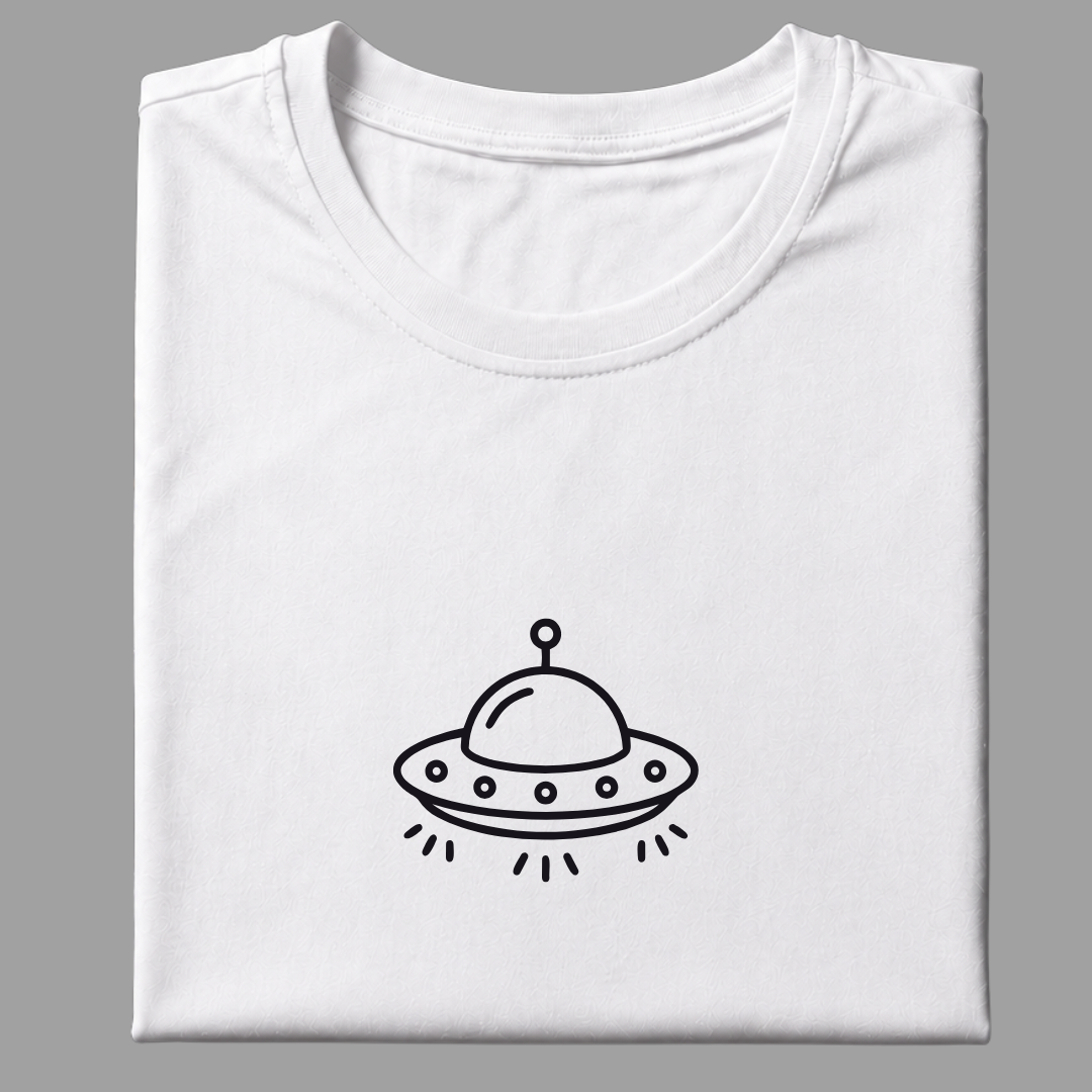 A folded white crewneck t-shirt with a simple black line art graphic of a flying saucer UFO printed on the chest, set against a solid gray background.