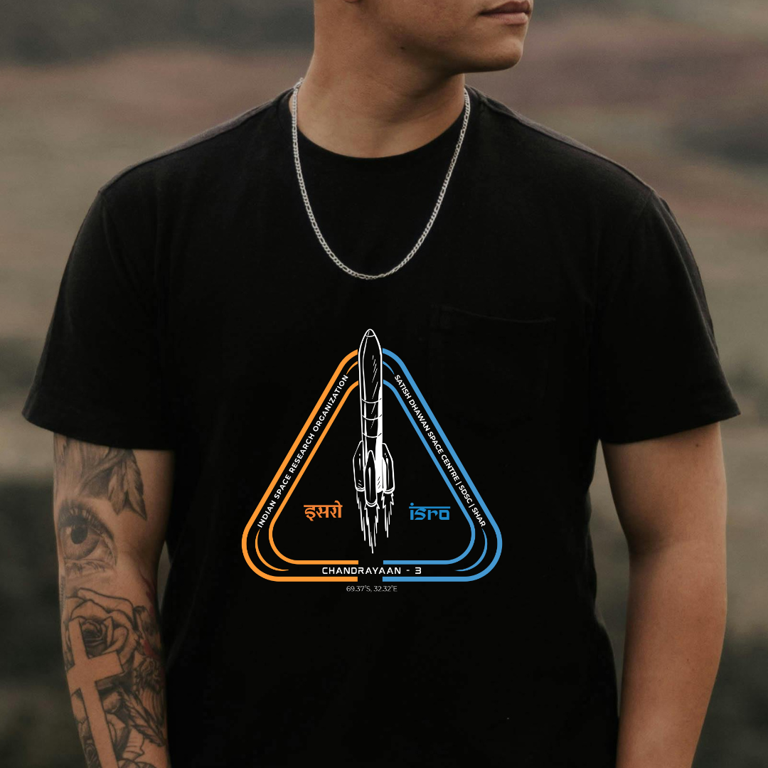 Person wearing a black t-shirt with a rocket design and text.