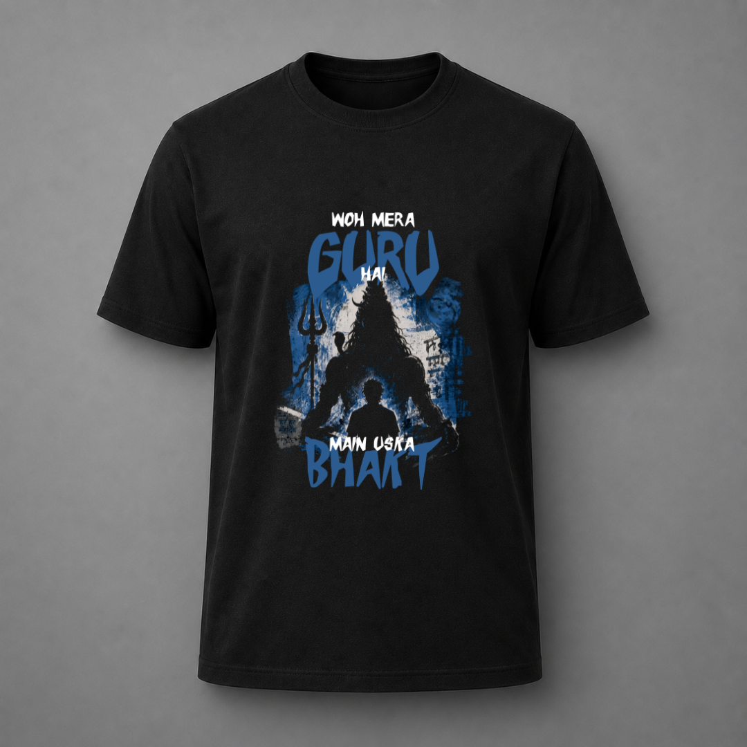 A black short-sleeve t-shirt with a blue and white graphic print on the front, featuring the Hindi text 'WOH MERA GURU HAI MAIN USKA BHAKT' and a silhouette of a guru figure, displayed against a neutral gray background.
